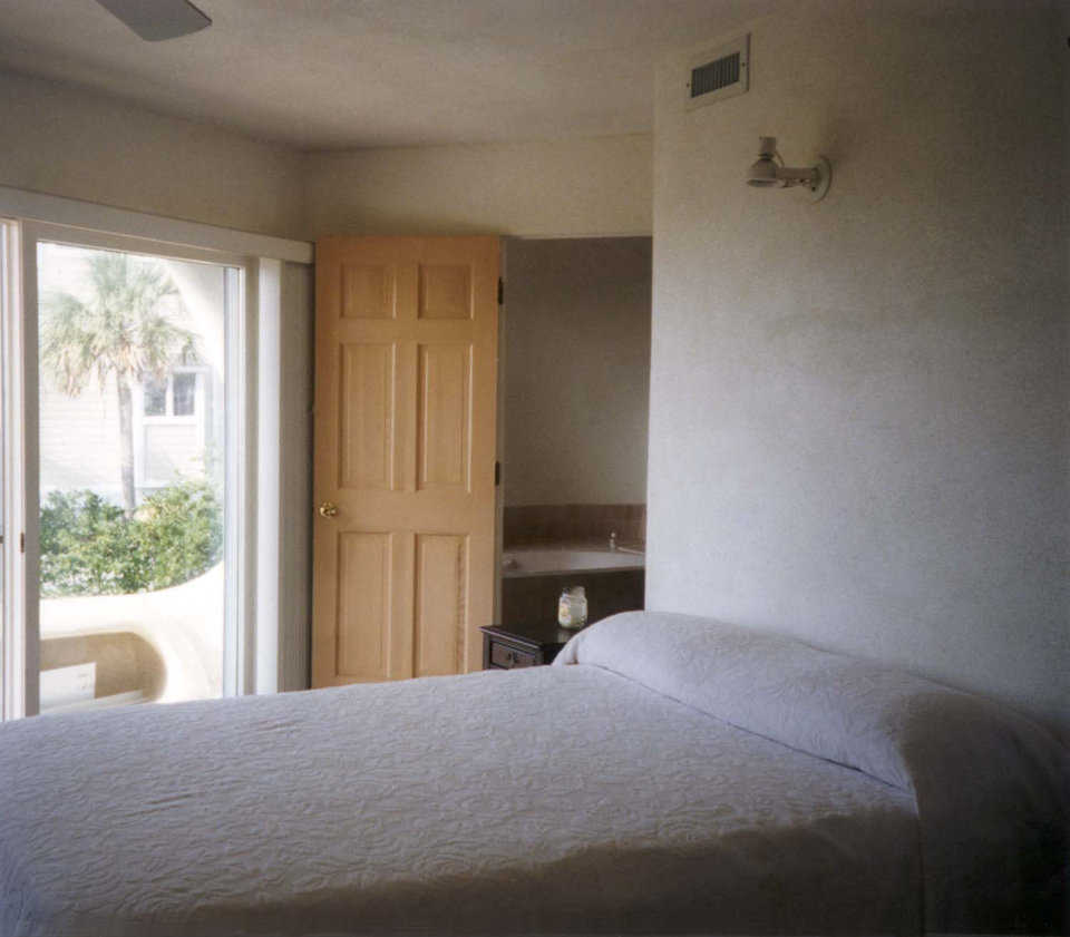 Master bedroom — Located on the third level, the master bedroom has easy access to the outside porch.