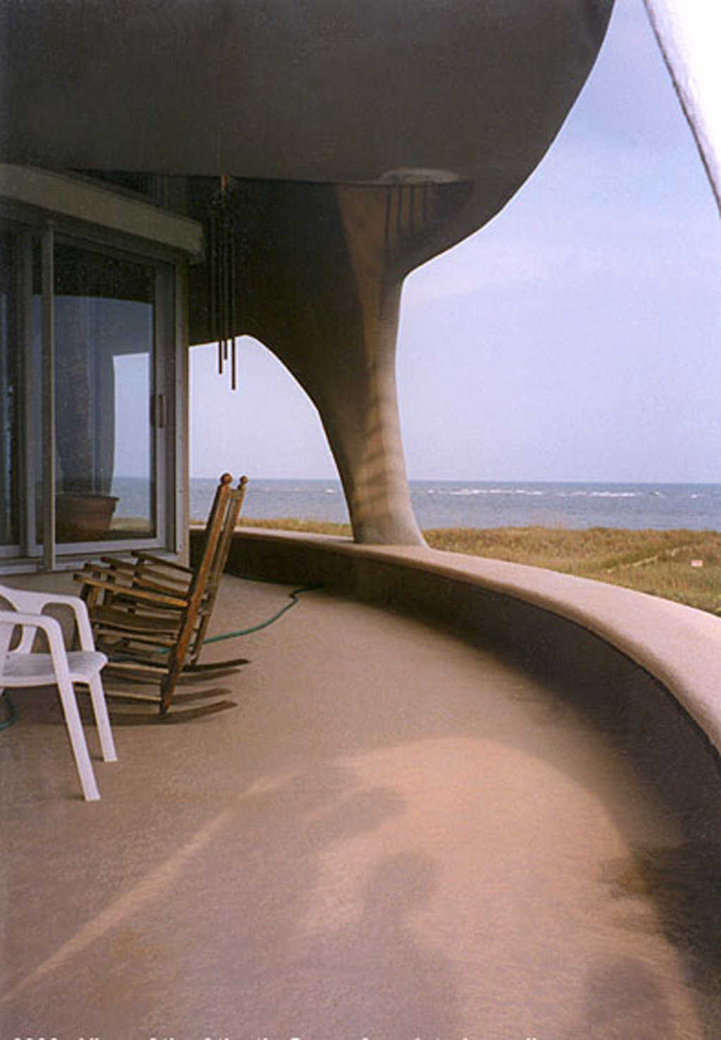 Up and out! — The main balcony, outside the living room, has a single pillar that is part of this Monolithic structure and is extremely strong.
