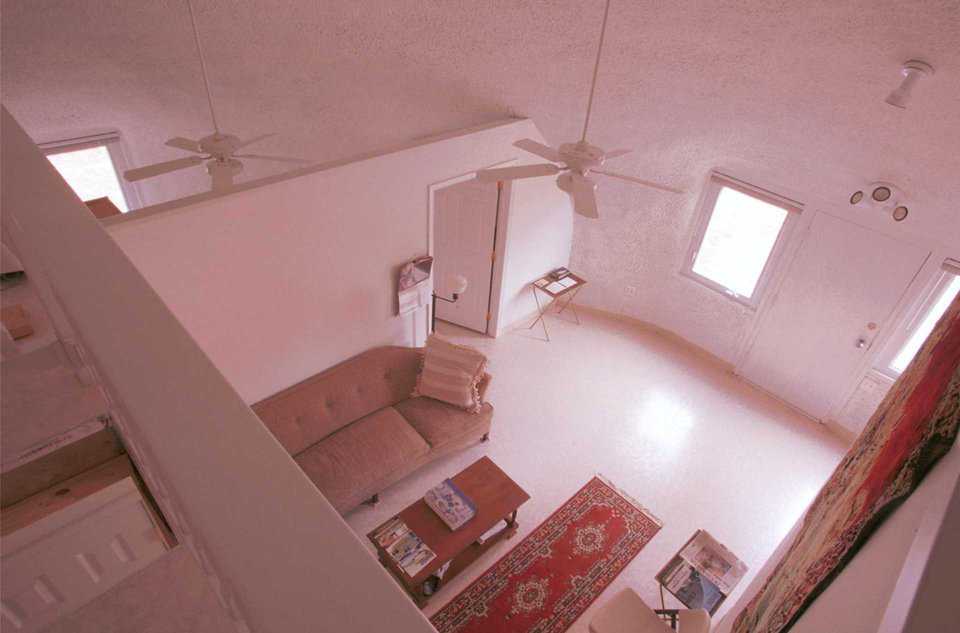 Loft-view of Living Room — View of the living room displays the open ceiling which creates an open, airy feel.