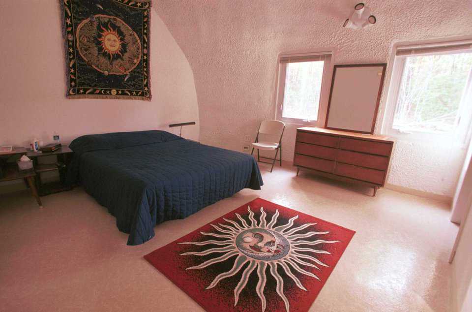 Master Bedroom — Oversized windows in the master bedroom provide a beautiful view of the autumn landscape.