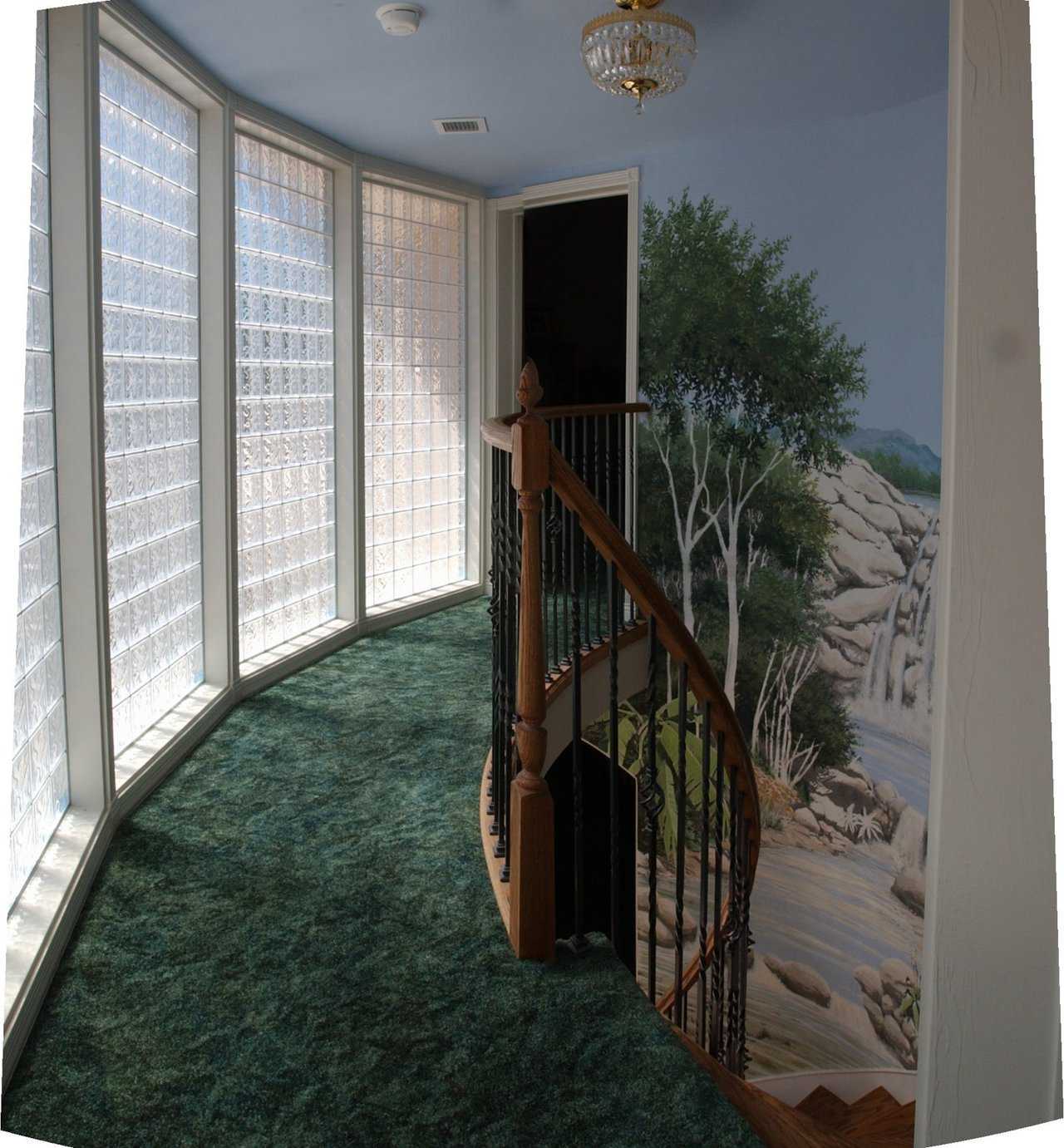 Hand-painted mural — It greets guests and family entering this fabulous Monolithic Dome dream home.