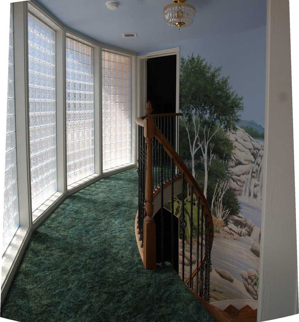 Hand-painted mural — It greets guests and family entering this fabulous Monolithic Dome dream home.