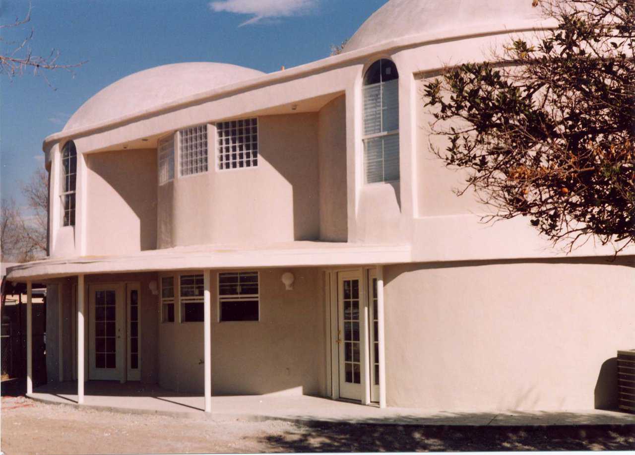 Twin towers — This Monolithic Dome dream home includes two domes, each 23’ in diameter and 7’ apart at center.