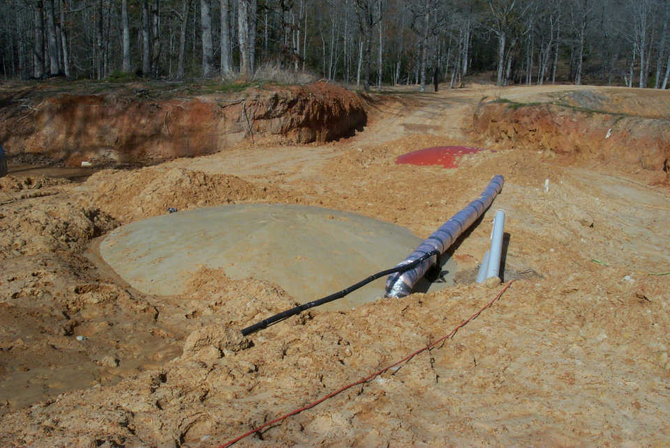 Weight-bearing Capability — Domes can efficiently bear the weight of being buried. The heating and air conditioning ducts for this underground home are housed outside the dome shell.