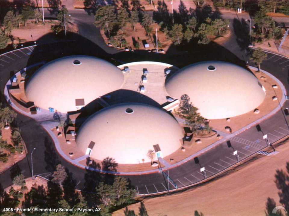 Three round structures — Visitors are surprised by the roominess and openness of the interior of these Monolithic Domes.