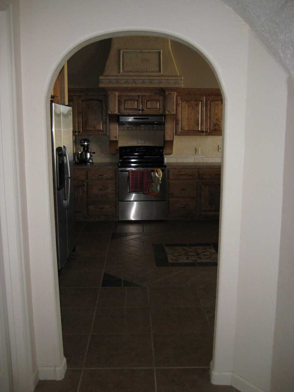 Kitchen — It sports an easy-to-care-for but beautifully tiled floor.