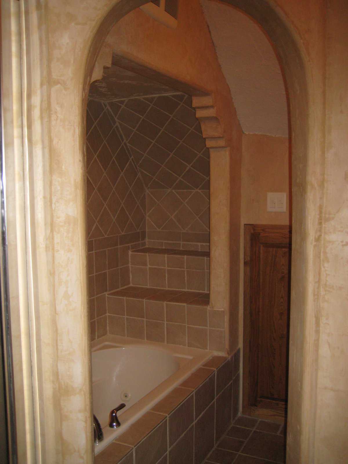 Tile shelves — They add to the look of luxury in this bathroom.