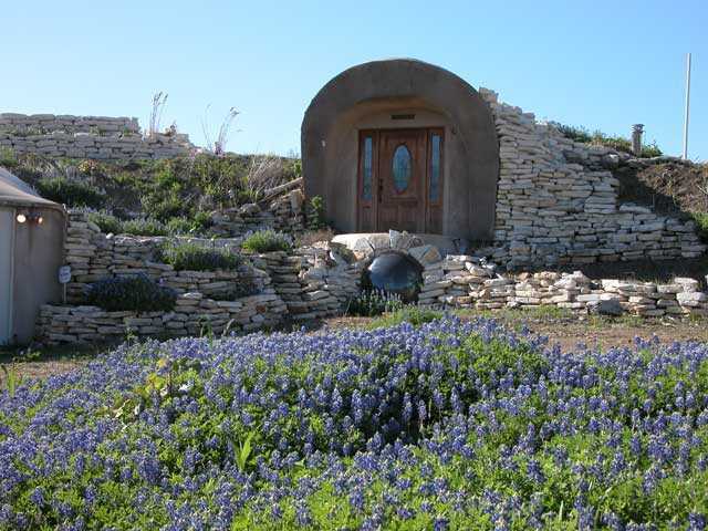 Robot Ranch.  — An elaborate door welcomes visitors to this Monolithic Dome home built into the side of a hill. Its gross floor area of 4,144 square feet includes two bedrooms and bathrooms, living area, kitchen, theater, office.