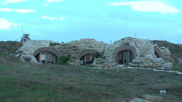 Interconnected domes. — The visible part of the seven interconnected domes is covered with rock. Rock stepping stones create the pathways too.