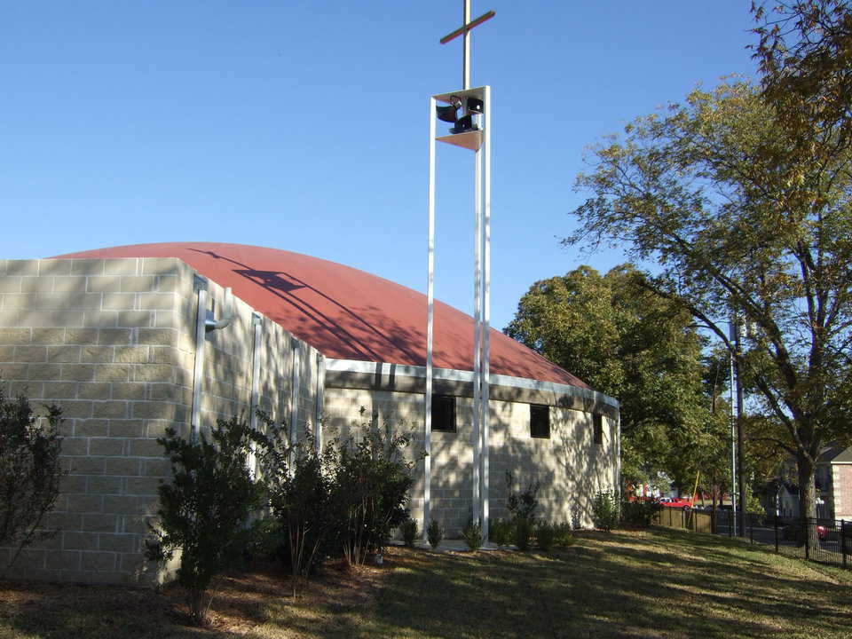 Bells, bells, bells — A white, bell tower topped by a cross extends above the dome. It houses carillon bells computer programmed to chime at certain times.