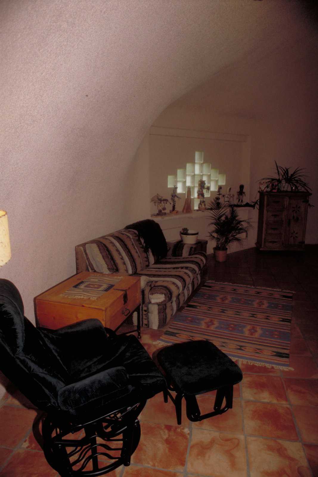 Small and cozy — Softly upholstered furniture and throw rugs add to the home’s feeling of warmth.