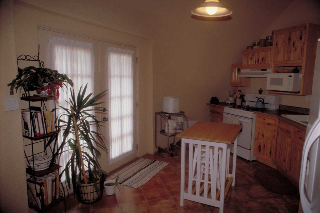 Efficient kitchen — It includes ample cabinets and a center island with added counter space.