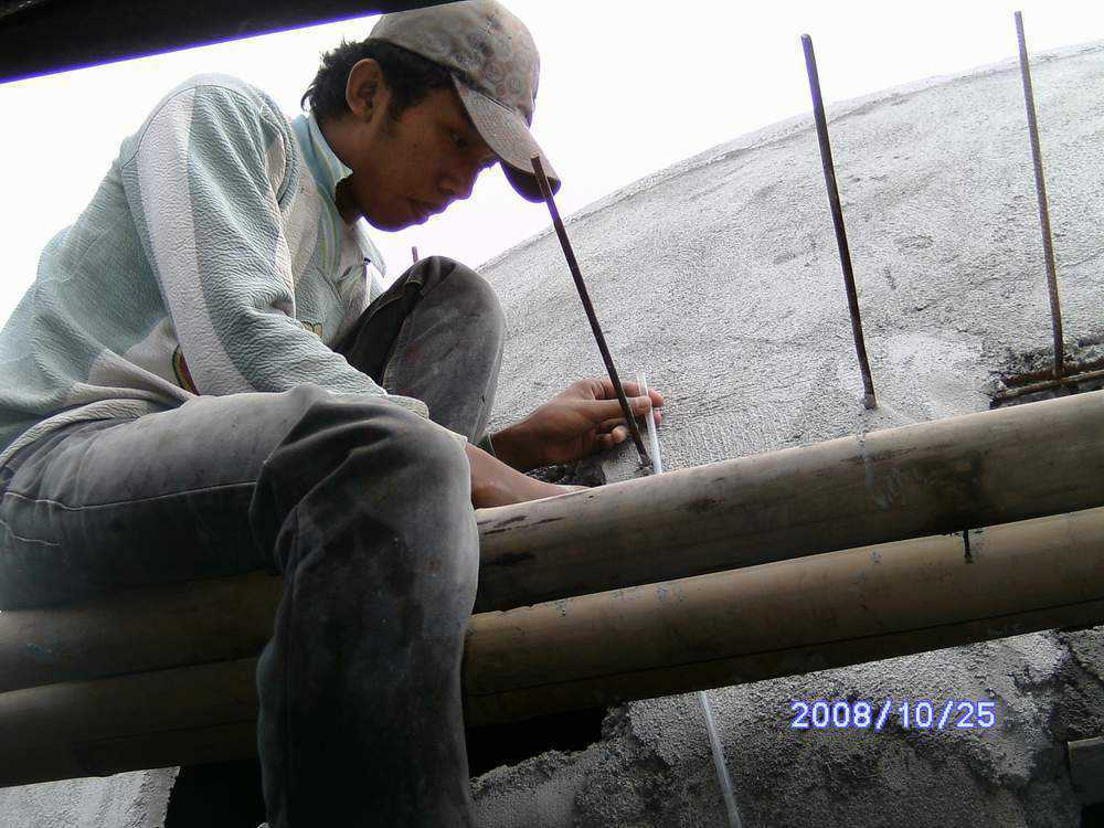 Progress — A villager diligently works on yet another EcoShell dome.