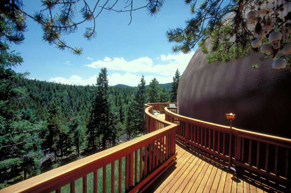 Walk in the treetops — The finely crafted, redwood deck has a walkway that seems to reach into the treetops.