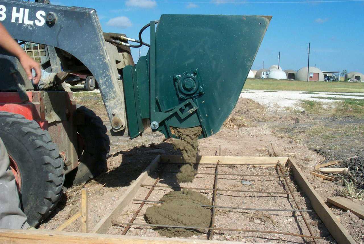 The Monolithic Mixer can also discharge from a chute on the side.  This side dump is especially handy for filling post holes, pilings, etc.