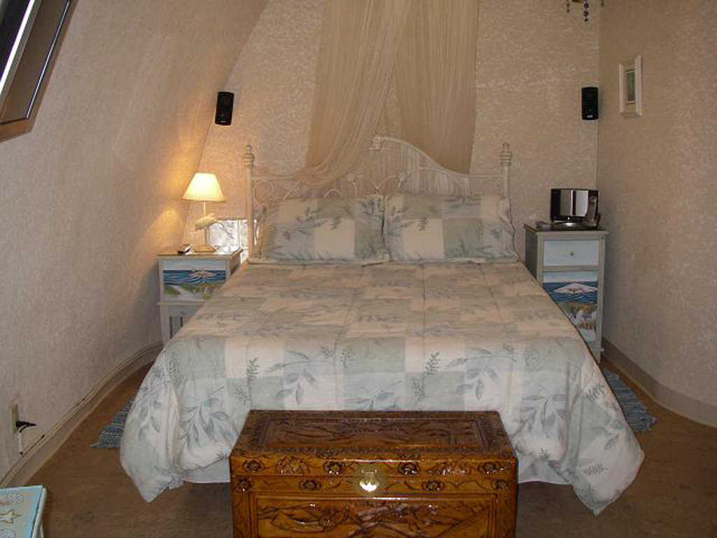 Second guest bedroom — It has a comfortable, queen-size bed and an unusual chest.