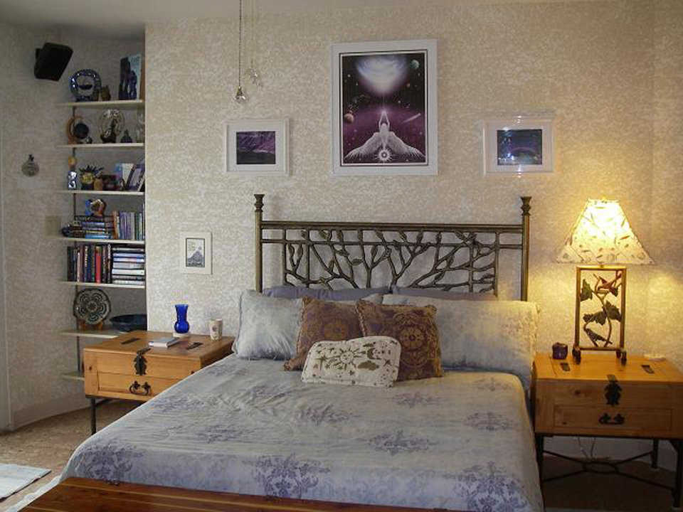 Third guest bedroom — Night stands and dressers in this bedroom have a natural wood finish.