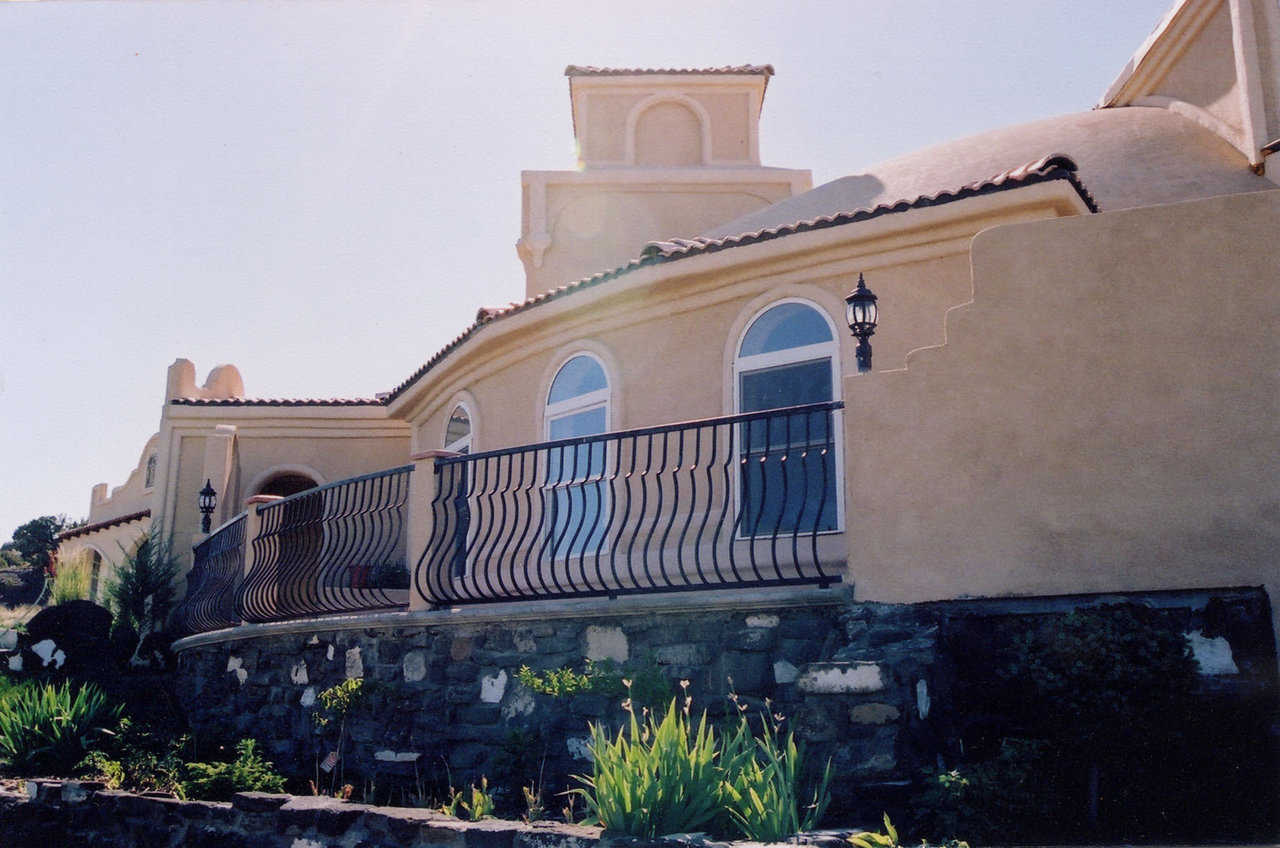 Decorative Rail — Balcony with an eye-catching rail creates an outdoor spot for rest and relaxation.