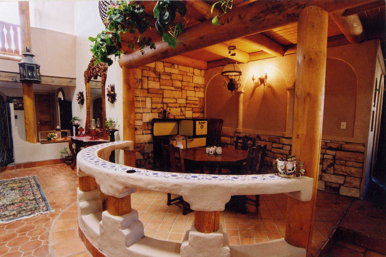 The Breakfast Nook — It’s set off the main living area by a circular divider made of concrete and wood.