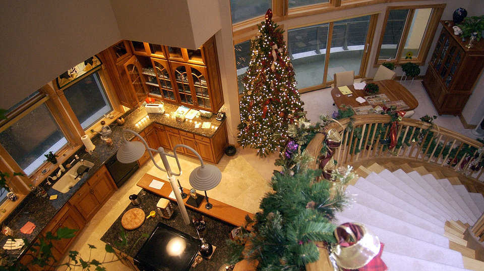 Third Level View — It overlooks the kitchen and dining area. The custom designed hickory staircase is the focal point of this dome.