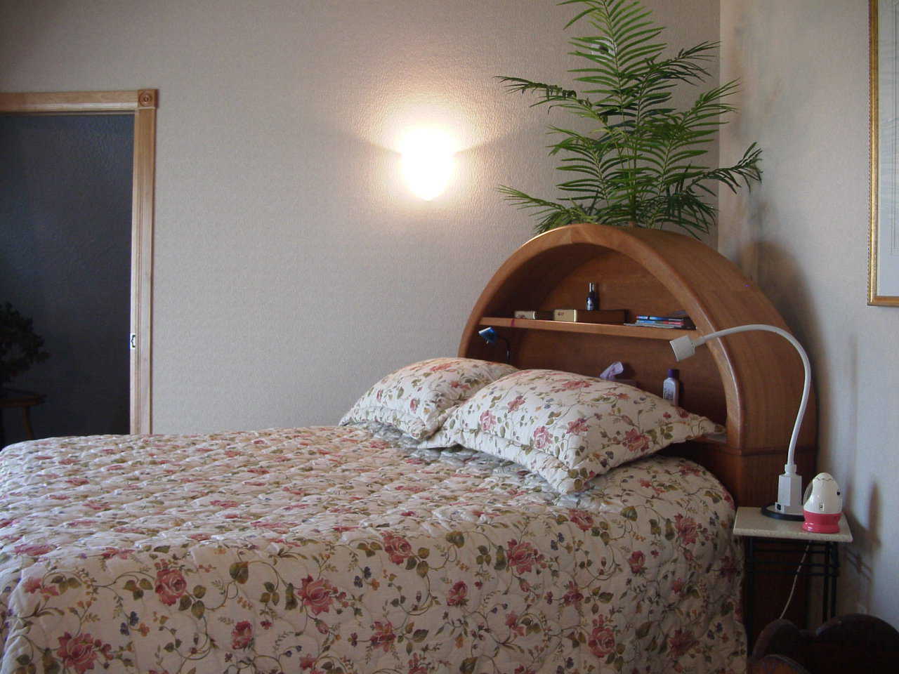 Master Bedroom — Barbara Stitt designed a massive, cherry-wood headboard for the master bedroom.