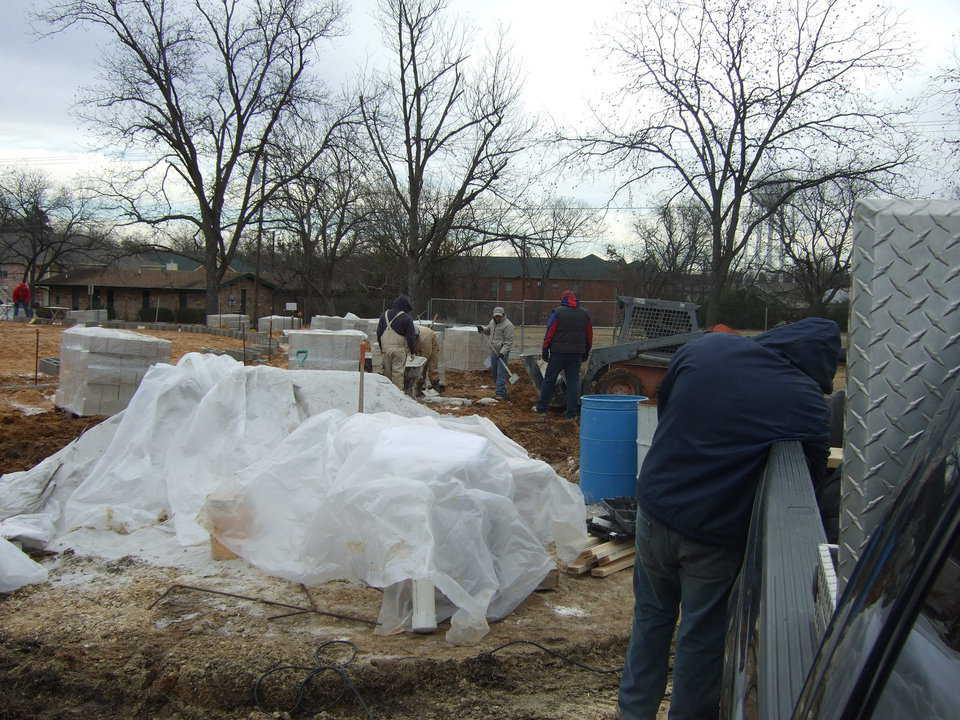 Men prepare for the day. The masonry sand that was used was so fine, that in the evening they had to cover it so that it wouldn’t blow away. This particular job they wanted to use white sand, so it wasn’t exactly cheap sand.