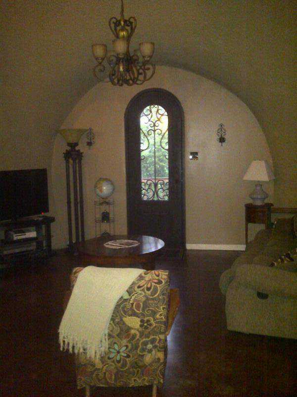 Visitors enter through an ornate, curved door.