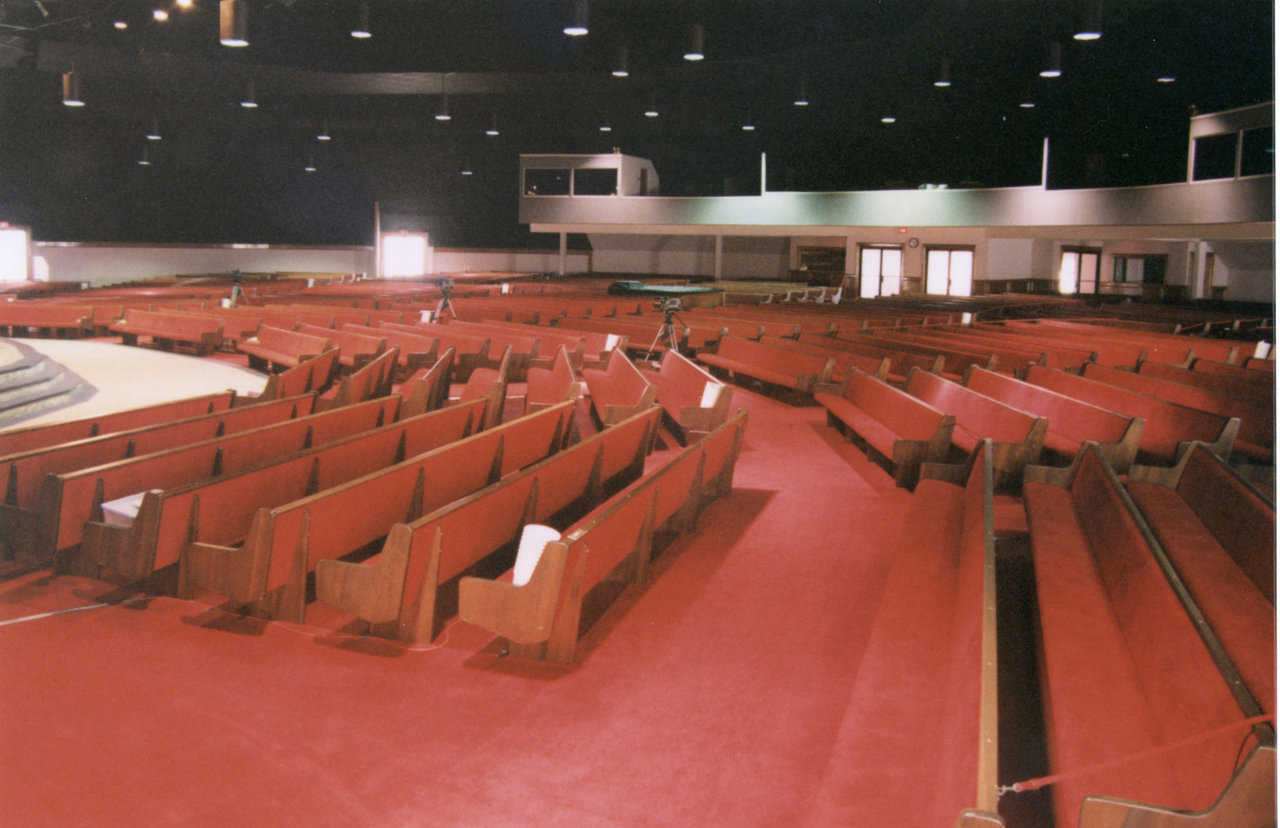The seating in the sanctuary curves around the platform.