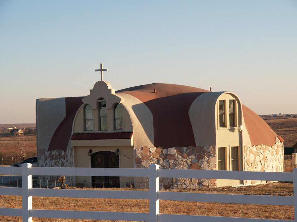 At first glance, this Monolithic Dome looks more like a church than a home. Nevertheless, it is a single-family residence. The owner hand-applied the rock, that provides an extremely durable, lower cover for the home.