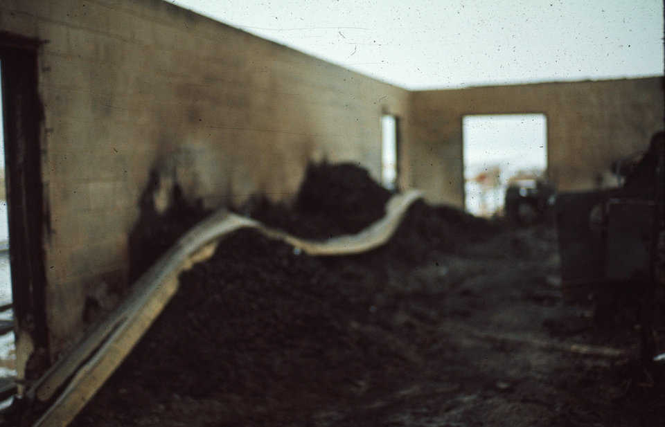 Fire cooks the potatoes!
Concrete and twisted steel is all that survived — along with the baked potatoes.