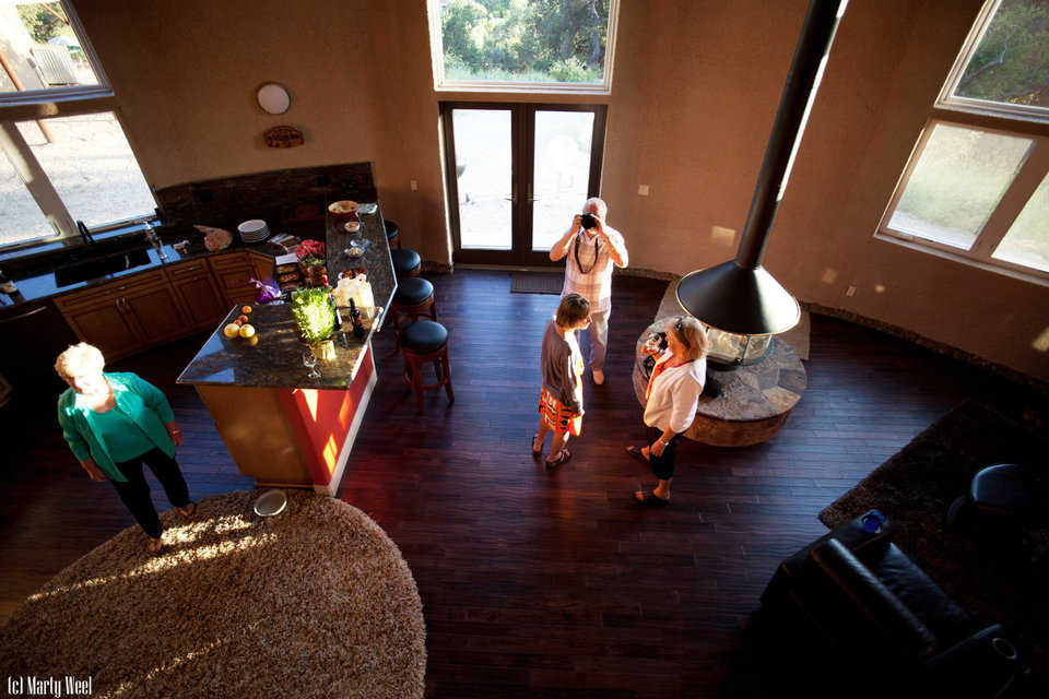 The living area includes a Spin-A-Fire fireplace with a circular, stone bench.