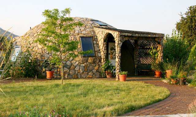 800-square-foot, spectacular, small home in Brigham, Utah. No A/C needed. Open windows at night to cool it. It stays cool all day. Owner Lori Hunsaker did the rock cover on the exterior herself.