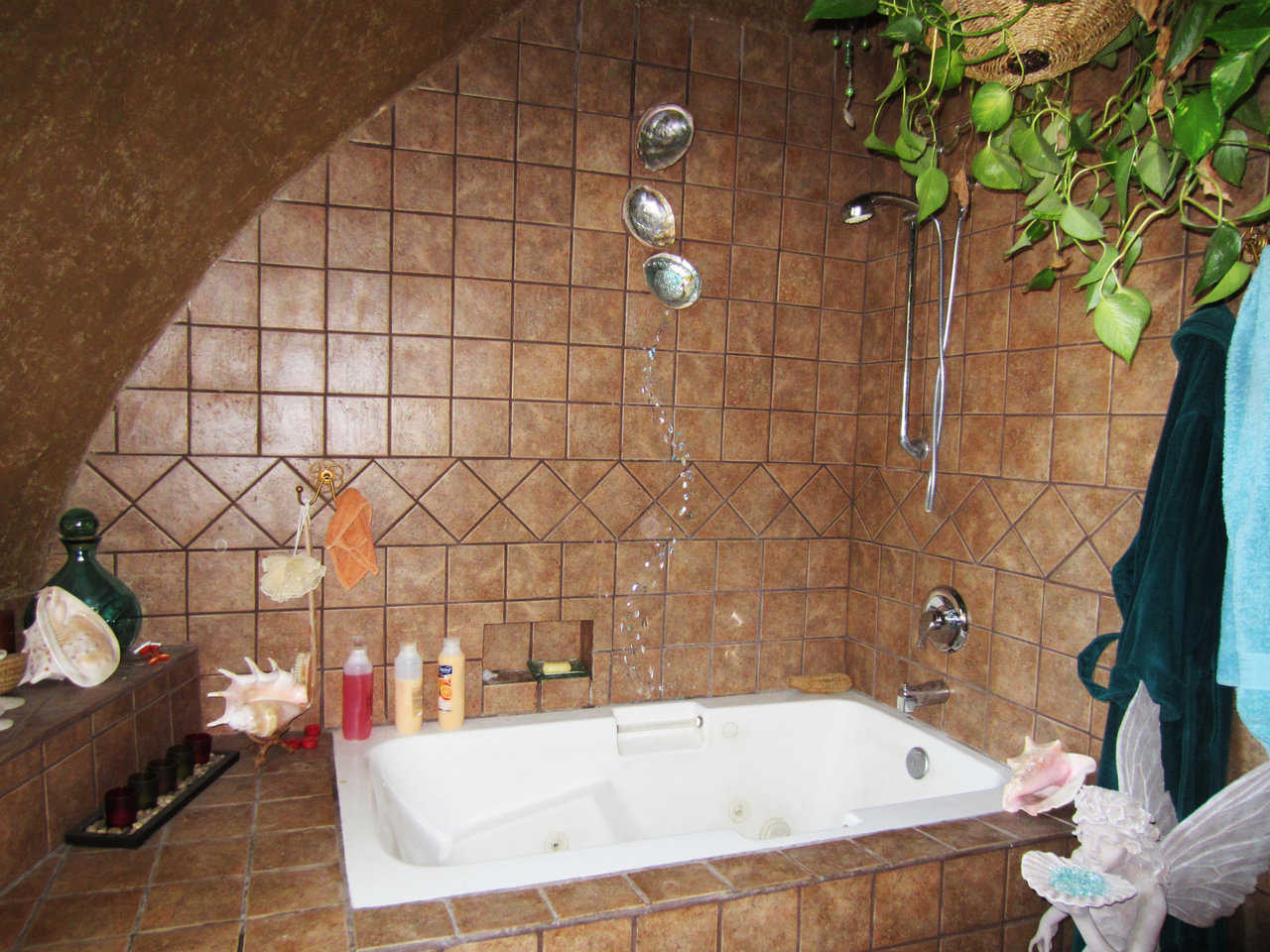 This bath was built by Lori. Note the beautiful tile work she did. This is a lovely home and a secure home — fire safe, earthquake safe — just simply safe.