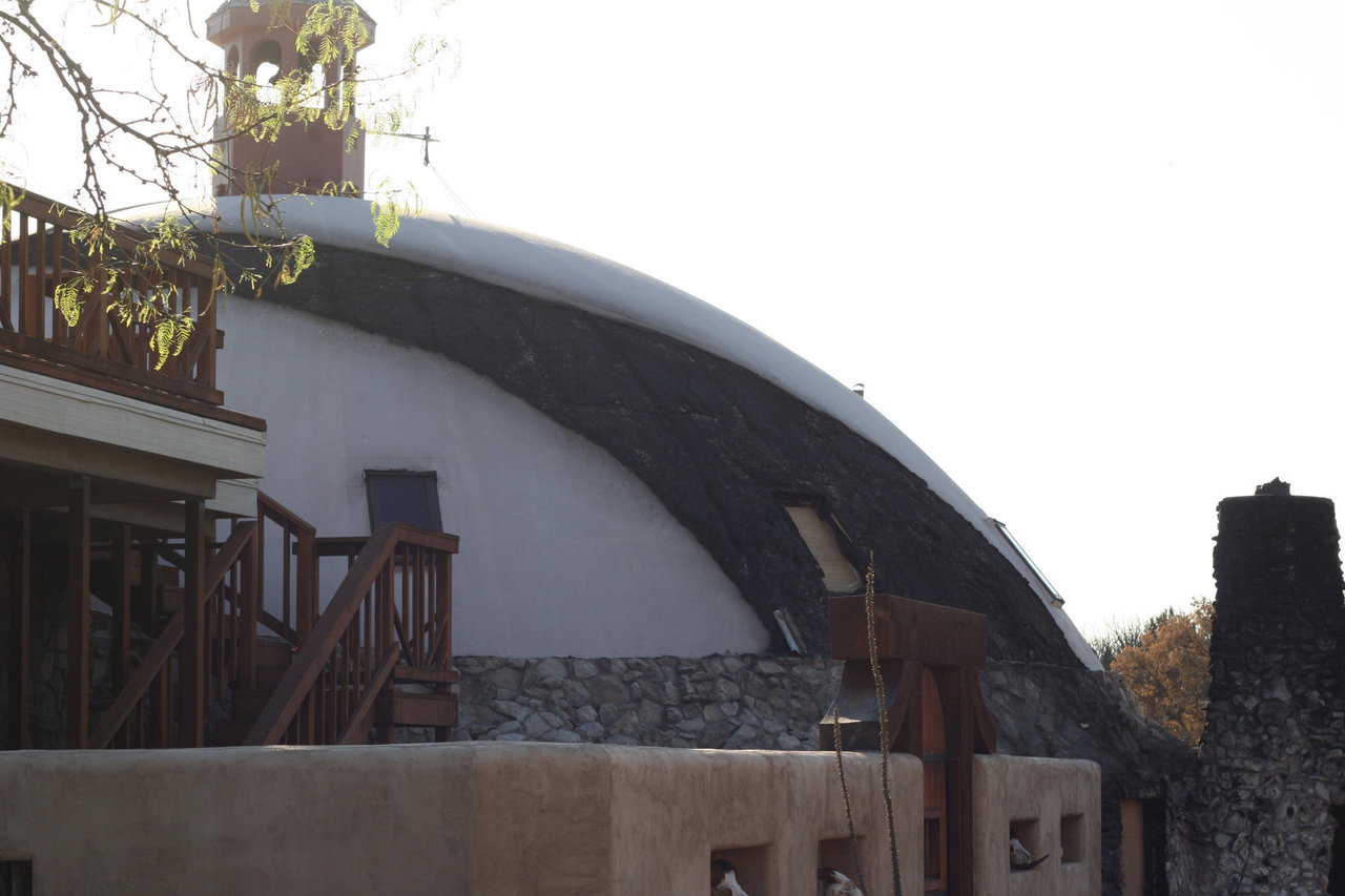 An attached greenhouse fueled a fire that blazed up the side of the dome.