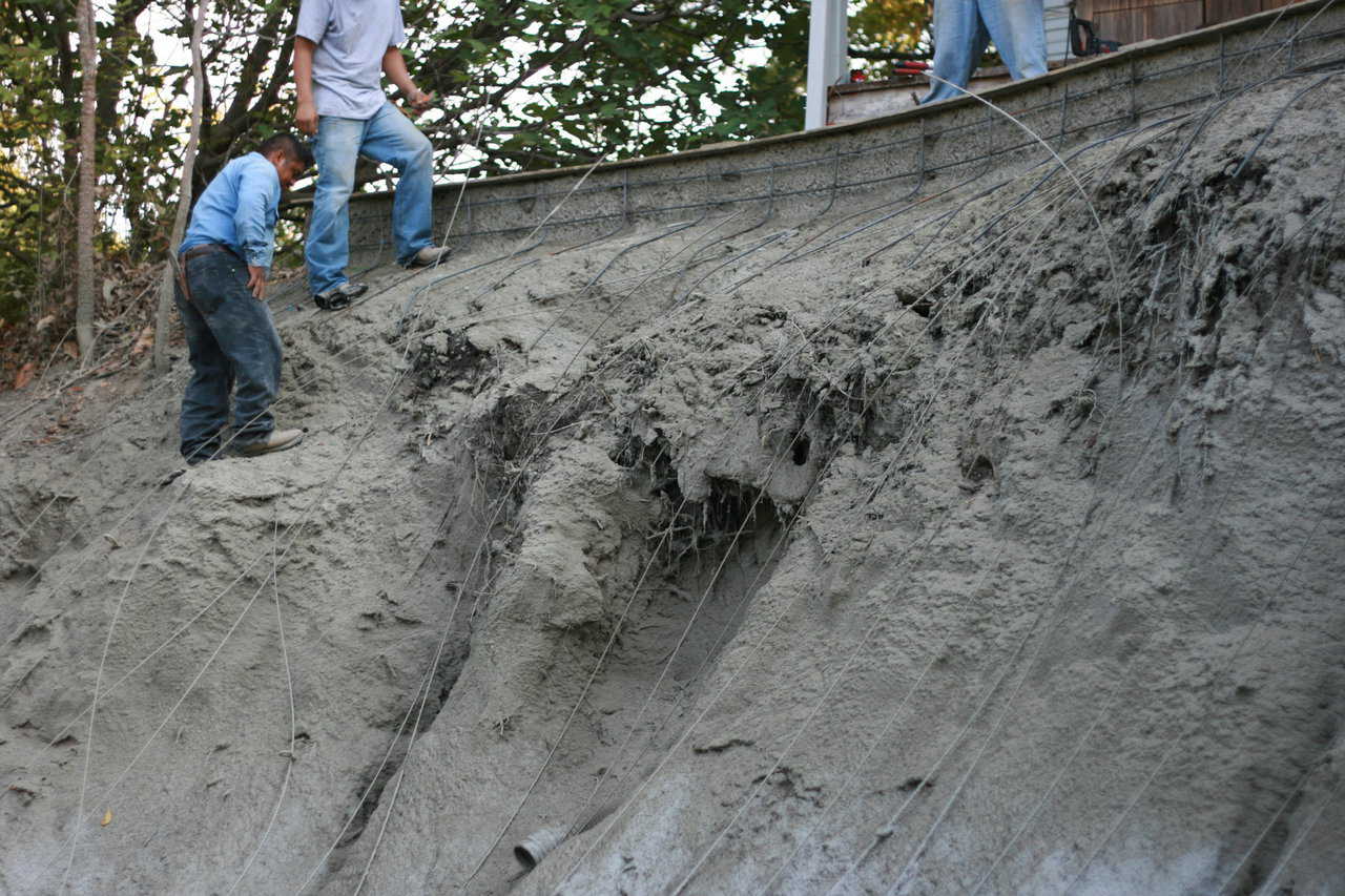 We began getting close to the top. Basalt was placed and forced to fit the slope of the embankment. At each step of the way more concrete was added to hold the dirt and the Basalt Rebar in place.