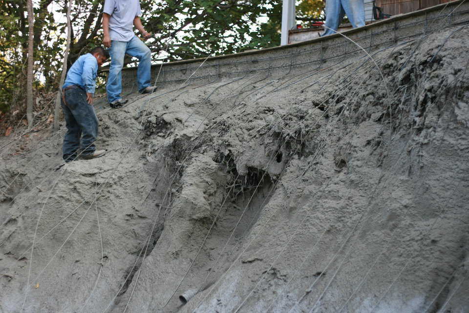 We began getting close to the top. Basalt was placed and forced to fit the slope of the embankment. At each step of the way more concrete was added to hold the dirt and the Basalt Rebar in place.