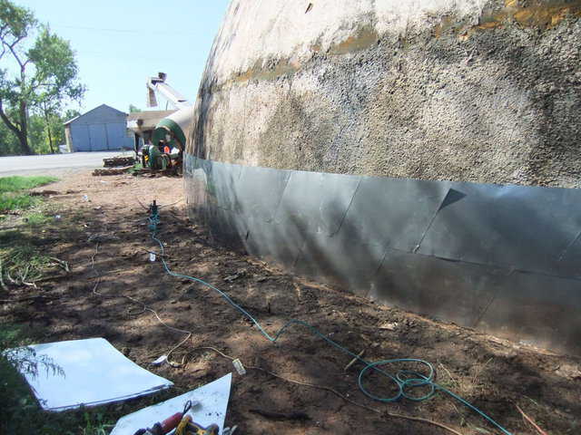 With two layers in place, workers had to be careful as the concrete wainscot was very rough, but the project continued successfully.