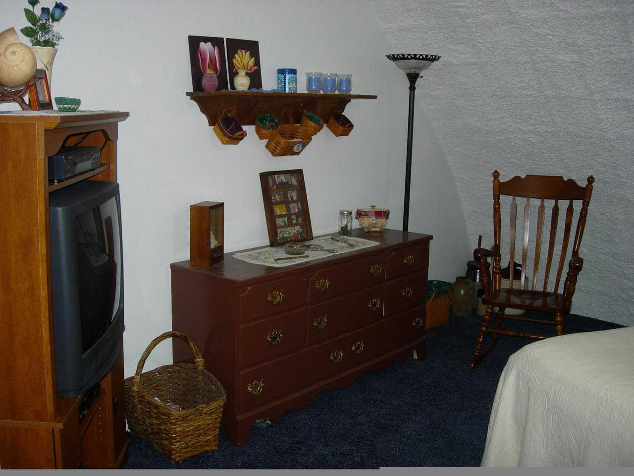 The spacious master bedroom has room for a TV and a favorite rocker.