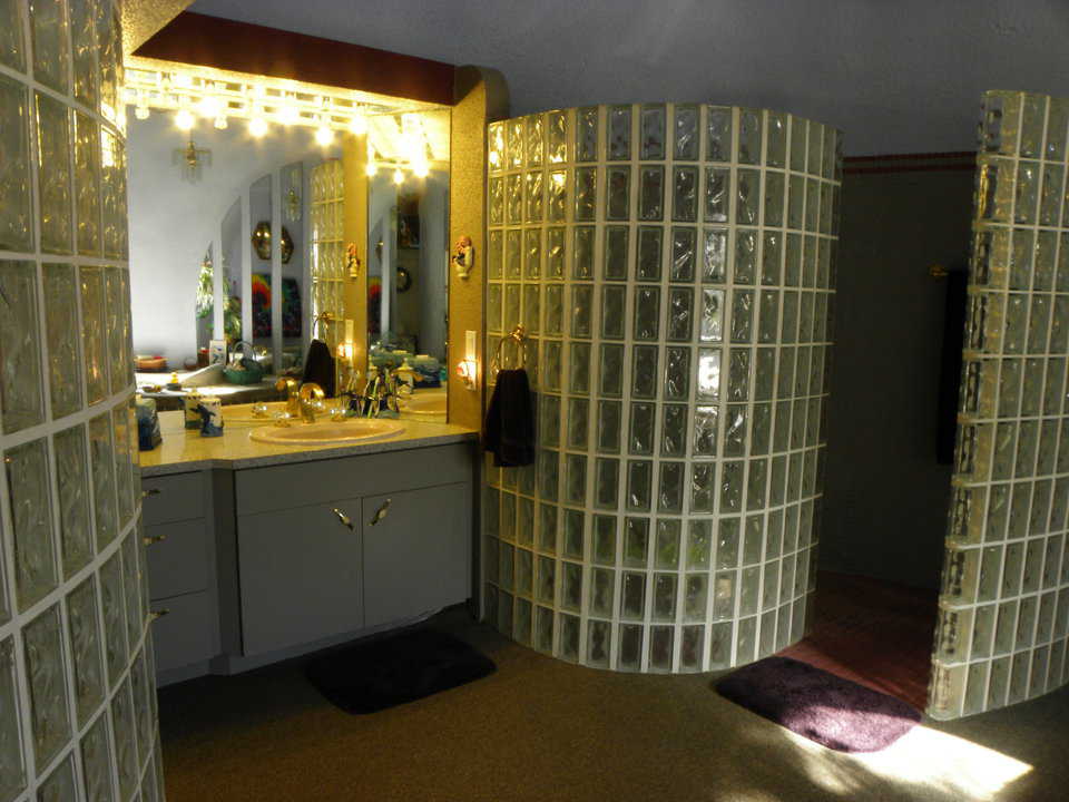 Blocks of shimmering glass create a look of luxury in the master bath.