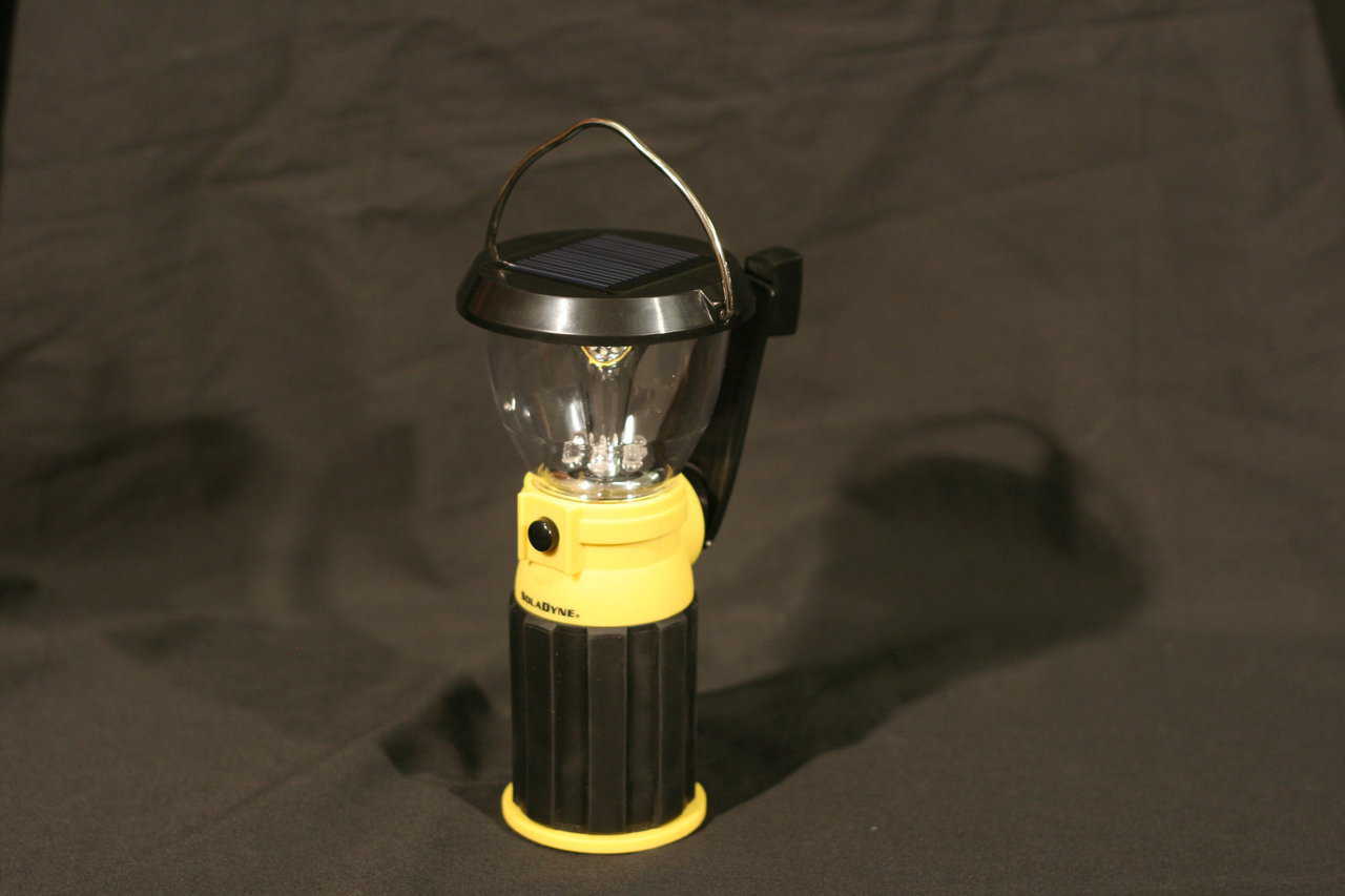 This LED emergency lantern can charge itself in the sun, or it can be charged by turning its handle for a couple of minutes.