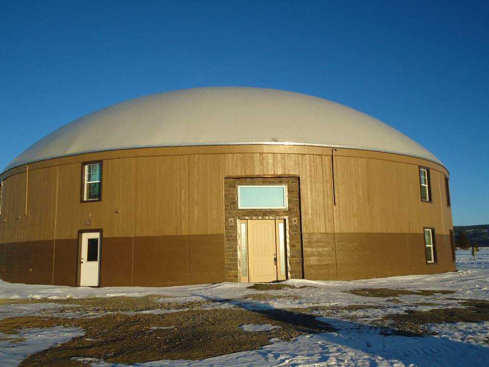 Please note the exterior: What looks like rough sawn wood is acutally concrete.  In the winter, transportation is arranged by a large snowcat pulling a schoolbus on skies.  The facility can easily handle 200 or 300 people.