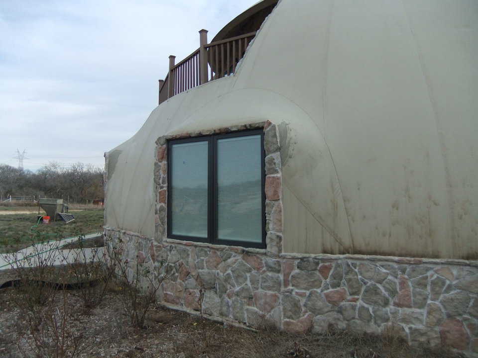 This is the dome as it stood when Monolithic arrived. The top corners of the windows had wrinkles that we flattened before applying the stucco.