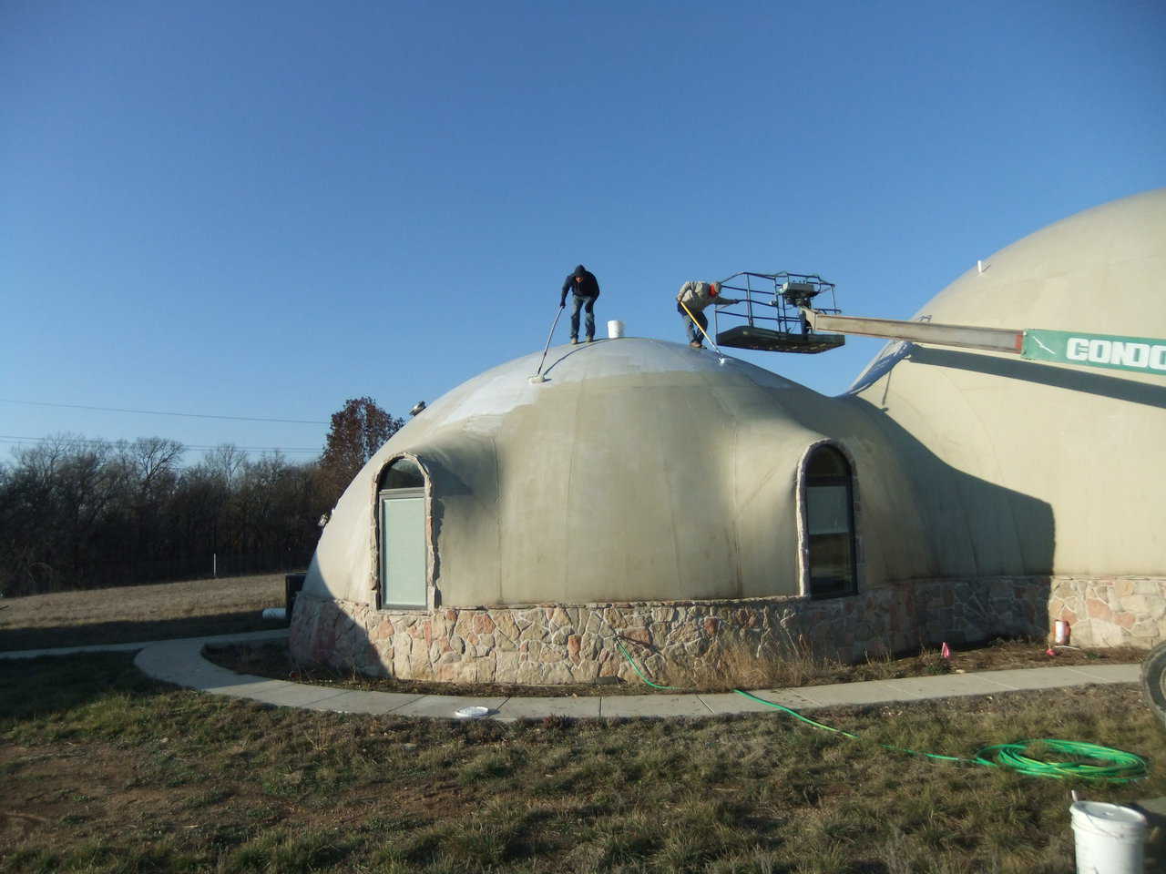The crew then applied our MonoForm primer to the outside of the structure.
