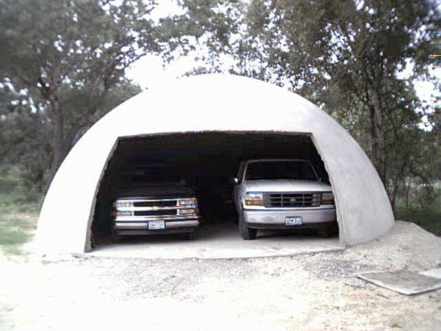 This is a 30’ diameter Ecoshell. It works extremely well as a garage. You can put a Monolithic Rotating Door on this building.