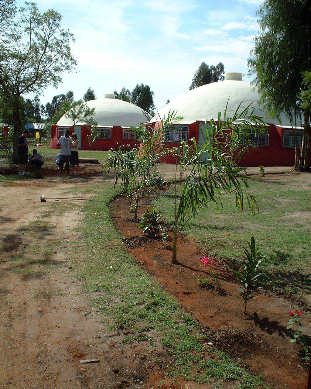 Here are two medical clinics built in Kenya, by hand, using Ecoshell I technology – extremely useful technology for low cost structures. Be sure to use Basalt reinforcing on the Ecoshells.