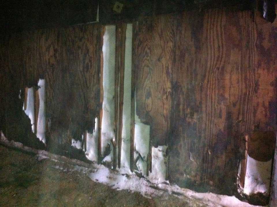 Here is an example of wooden bin walls.  Notice the abuse that these walls have taken over the years of loader operators hitting them. Try that on a concrete wall and you may have to fix the loader.  All of the product that is within the walls and on the wet floor is lost product.  The next image shows the inside of a Monolithic bin.