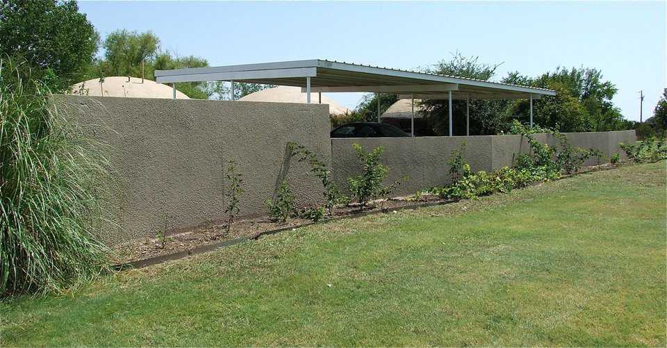 A spray-in-place concrete fence adds a beautiful touch to any yard or provides privacy for your home or business. It separates and defines a yard and is a beautiful backdrop for landscaping.