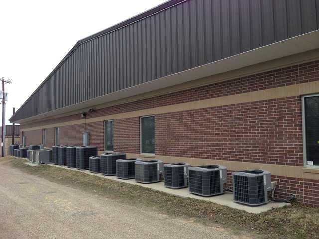 This Texas school has two conventional buildings, each with 20 air conditioning units along its back wall. That’s 40 units for just one tax-supported school! What does it cost to install and run 40 ac units in hot, humid Texas? Also, consider that this is a school for less than 300 students.