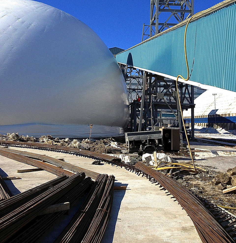Monolithic’s Airform being inflated next to the existing equipment.