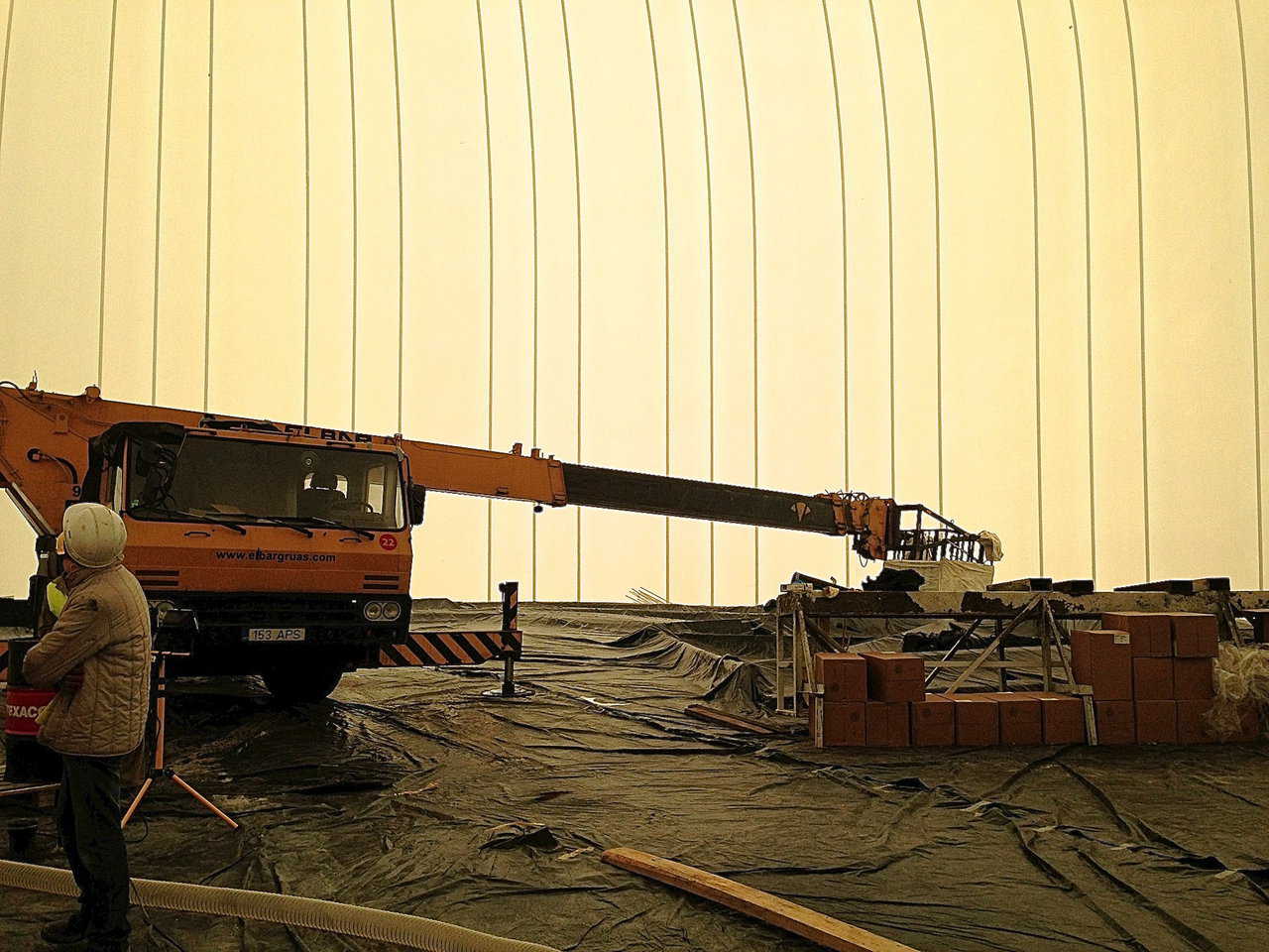 Airforms are spread over the equipment used to build the dome.
